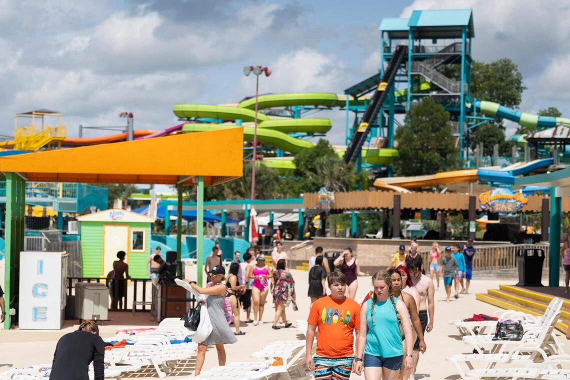 People make their way around to rides Wednesday, June 1, 2022, at Hurricane Harbor in Arlington.