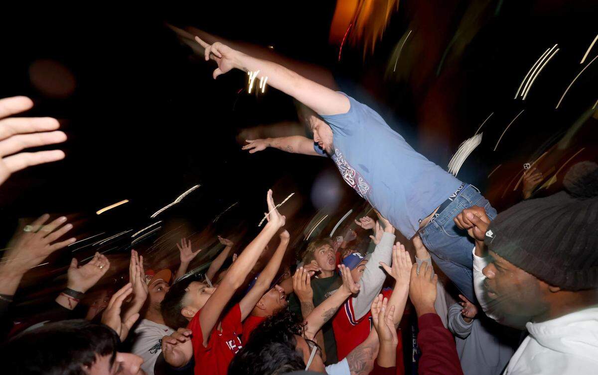 Rangers fans celebrate outside of Texas Live! in Arlington after the Rangers won the World Series on Wednesday, November 1, 2023.
