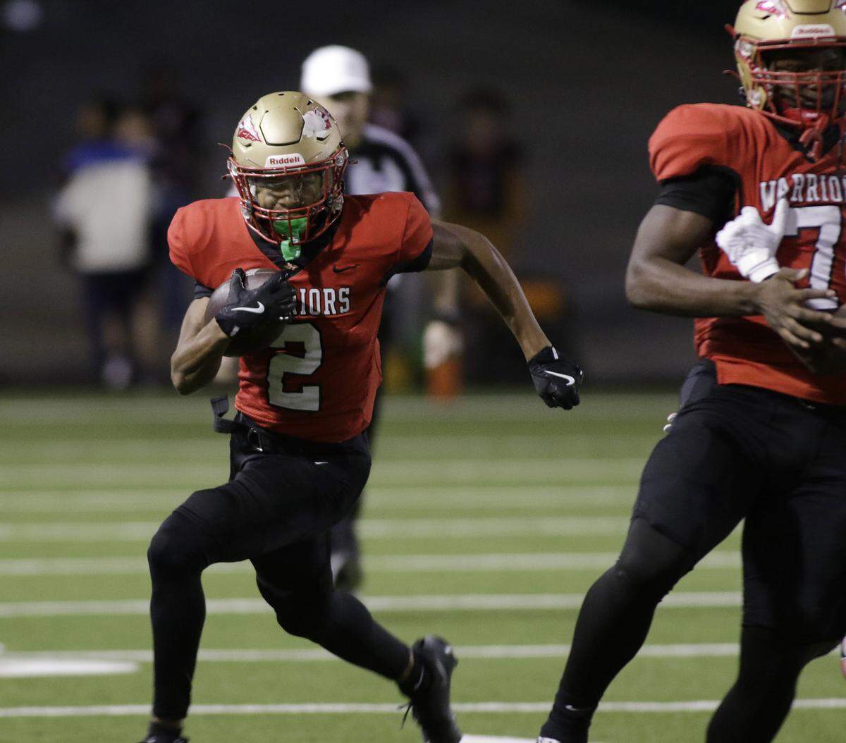 South Grand Prairie’s Cade Wallace takes a reverse on the first play from scrimmage for a touchdown against Haltom during their game at the Gopher-Warrior Bowl on Friday, Oct. 31, 2025. 