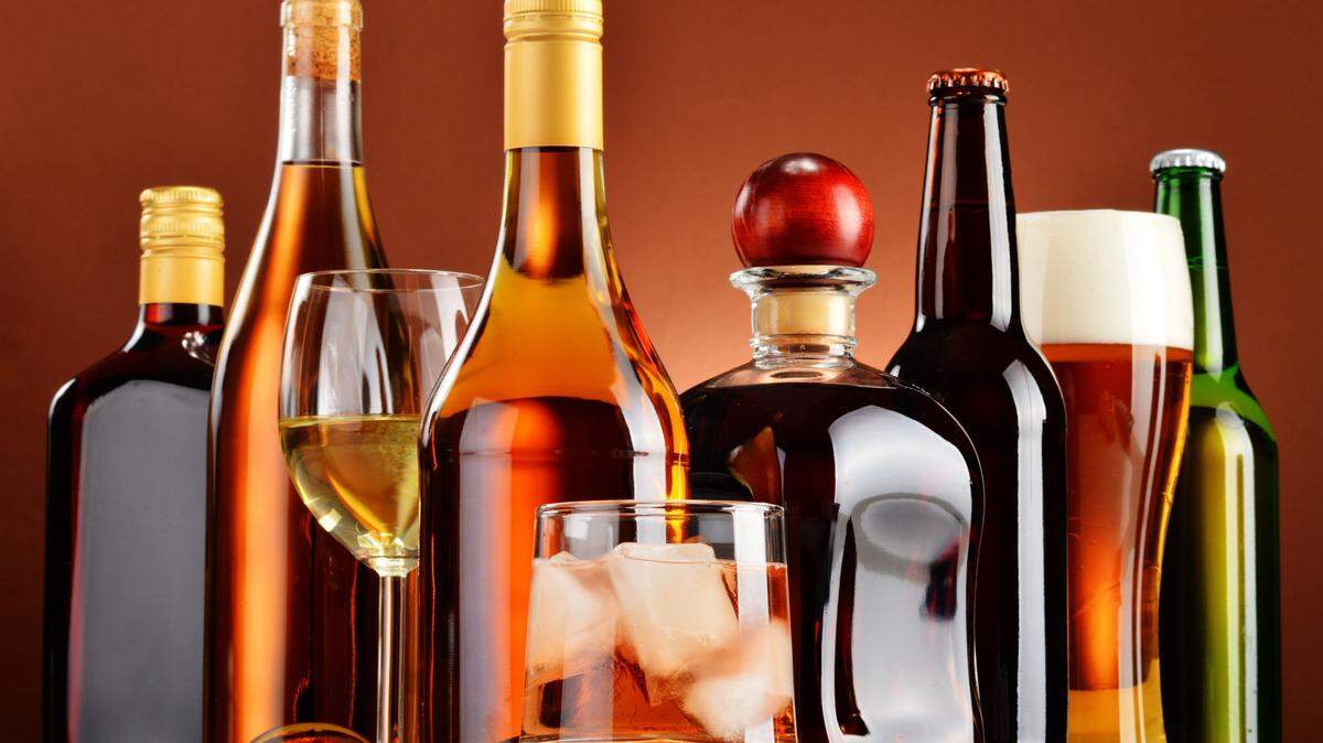 Bottles and glasses of assorted alcoholic beverages - Thinkstock Photos