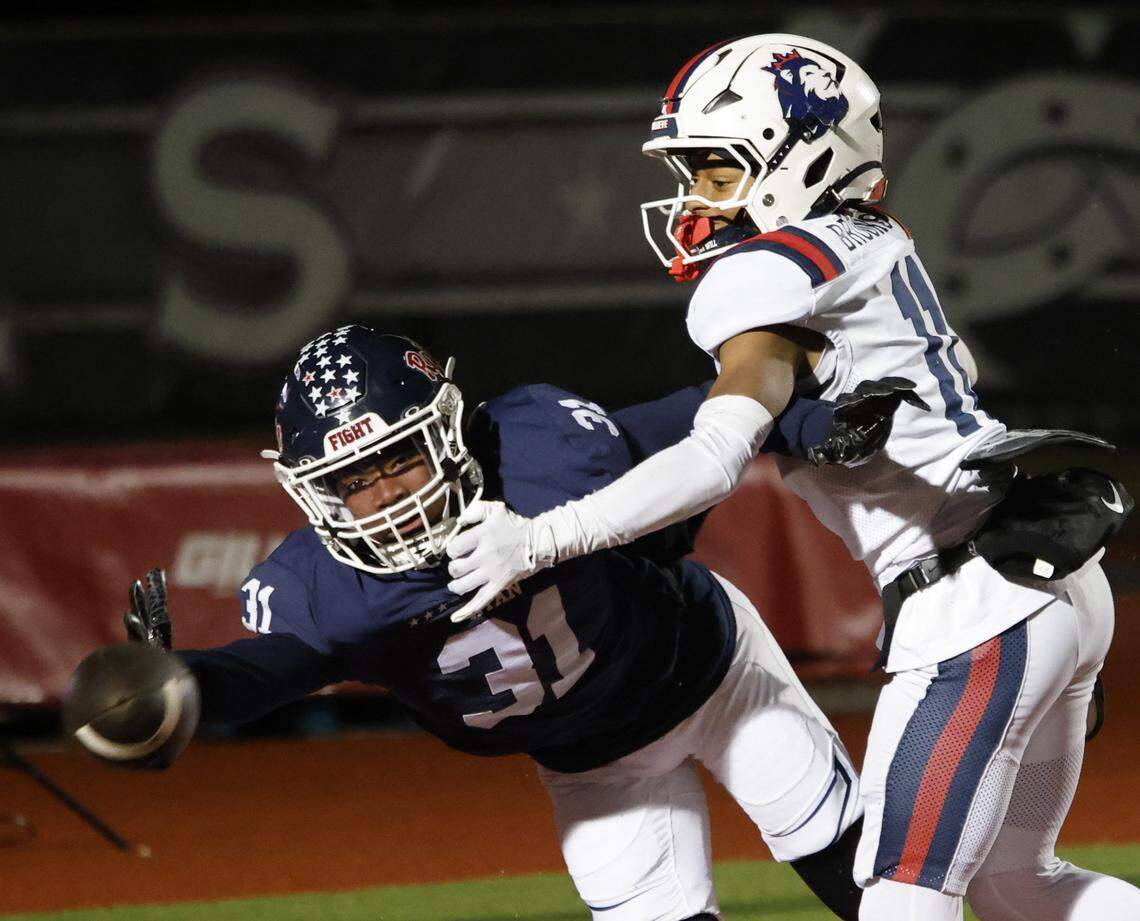 Denton Ryan defensive back Alijah Friday (31) reached for a pass intended for Richland defensive back Aaron Brooks (11) in the end zone during the second half of a UIL Class 5A Division I Regional on Friday Nov. 28, 2025 at Buddy Echols Field in Coppell, Texas.