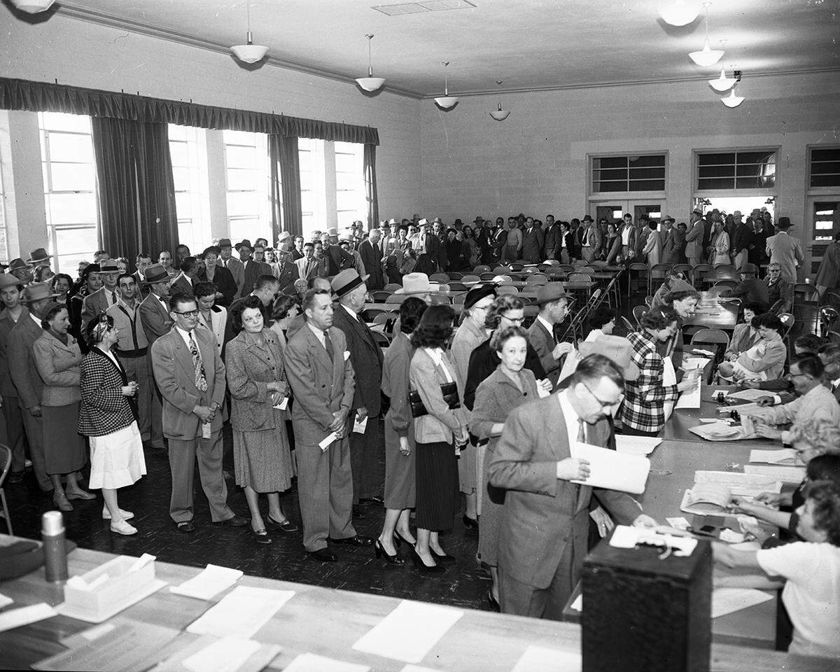 Nov. 4, 1952: Voters jammed polling places in Fort Worth and Tarrant County on Tuesday, as evidenced by these photos taken at Precinct 117, Bluebonnet School. Crowds of voters here were so great they had to be moved to permit children to enter school. A block-long line awaited officials when the voting started at 7 a.m. At 11:30 a. m., 1200 of the precinct’s 3180 voters had cast their ballots.