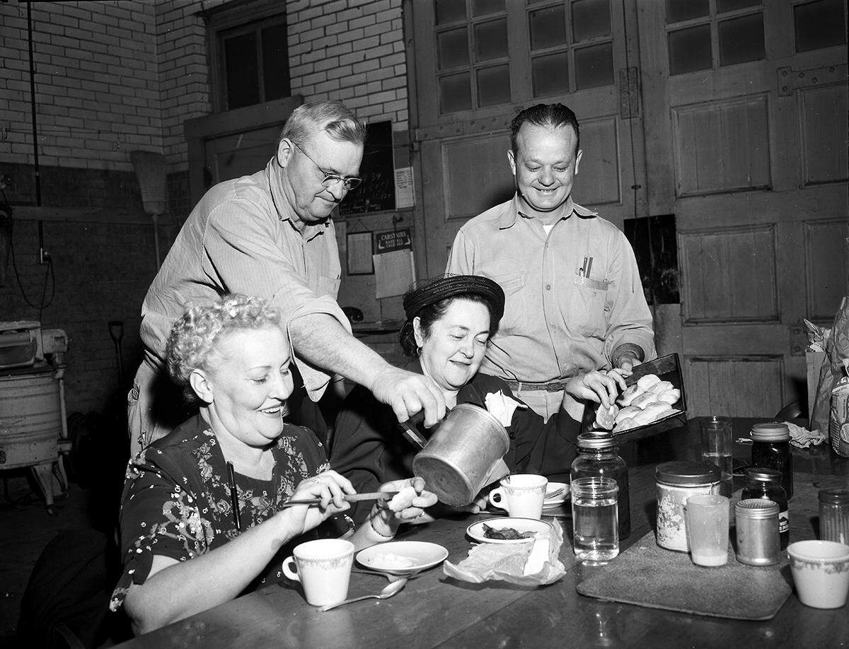 April 3, 1951: Two veteran vote-counters were served coffee and biscuits at Precinct 3 in the fire station at 1700 Jones early before their chores in the city election. Seated are Mrs. James J. Stamps, left, assistant judge, and Mrs. W. A. James, election judge and precinct chairman. Serving them are City Fireman A. K. Freeman, pouring coffee, and Jack Thomson.