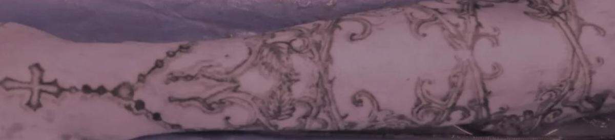 Tattoos on man's arm. 