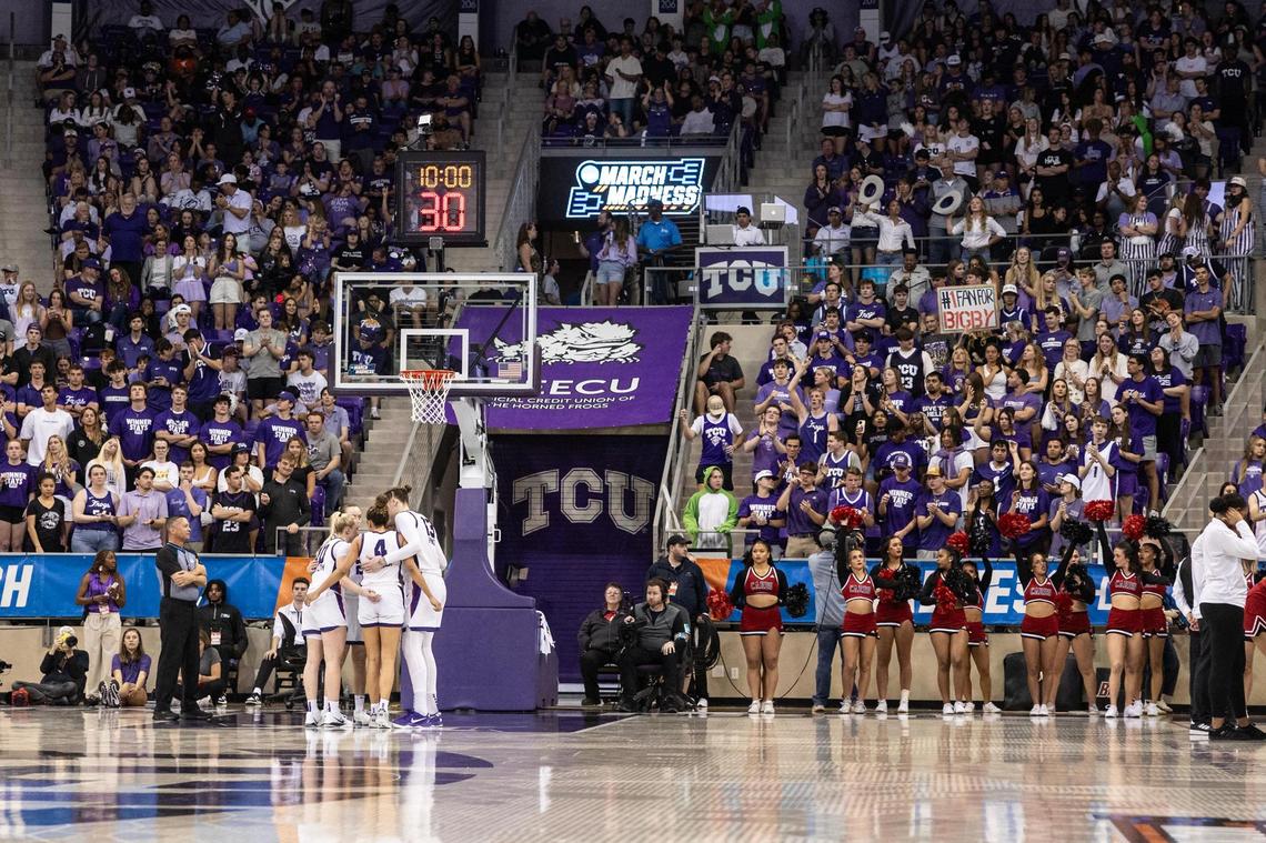 The TCU Women’s basketball team huddles up before the start of the fourth quarter as the crowd cheers them on in the second half of the second round of the Women’s NCAA Championships Tournament game between TCU and Louisville at Schollmaier Arena in Fort Worth on Sunday, March 23, 2025.