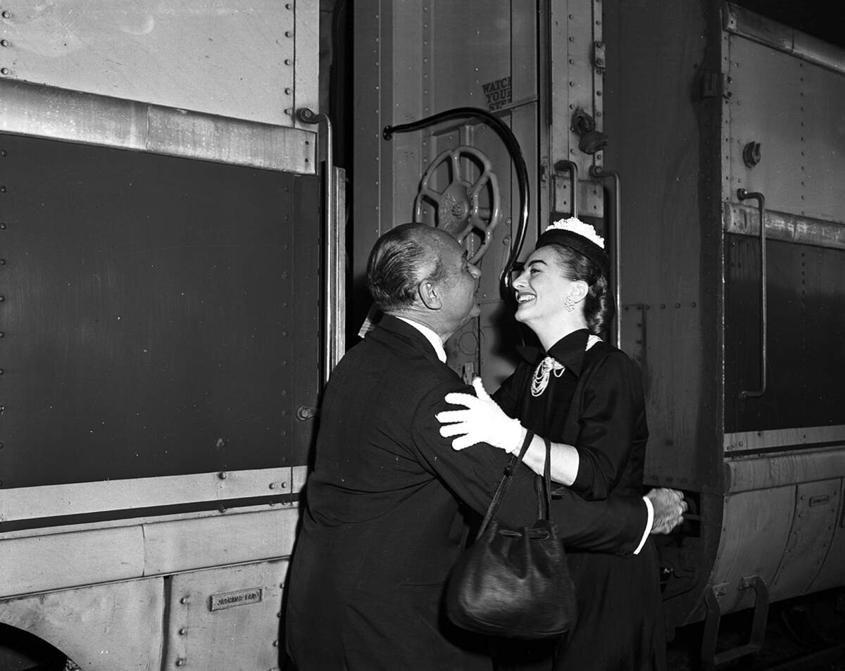 May 30, 1952: Joan Crawford of the movies greets Bill Haimes, a former star himself, on her arrival in Fort Worth for the Mint Bar Party of the Fort Worth Art Association.