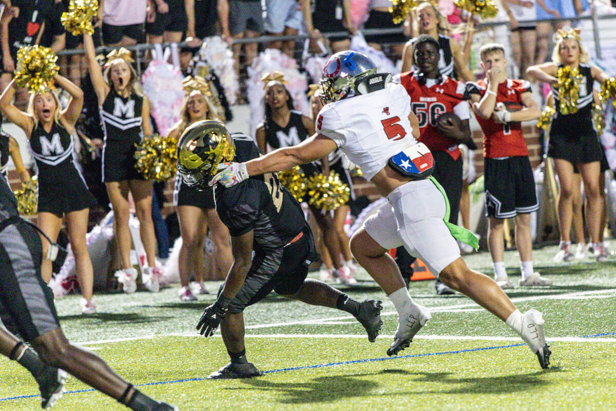 Mansfield running back Raymond Weaver gets outside of Legacy linebacker Carson Cox to score a touchdown In Friday’s game at Vernon Newsom Stadium. Special to the Star-Telegram / Tom Marvin
