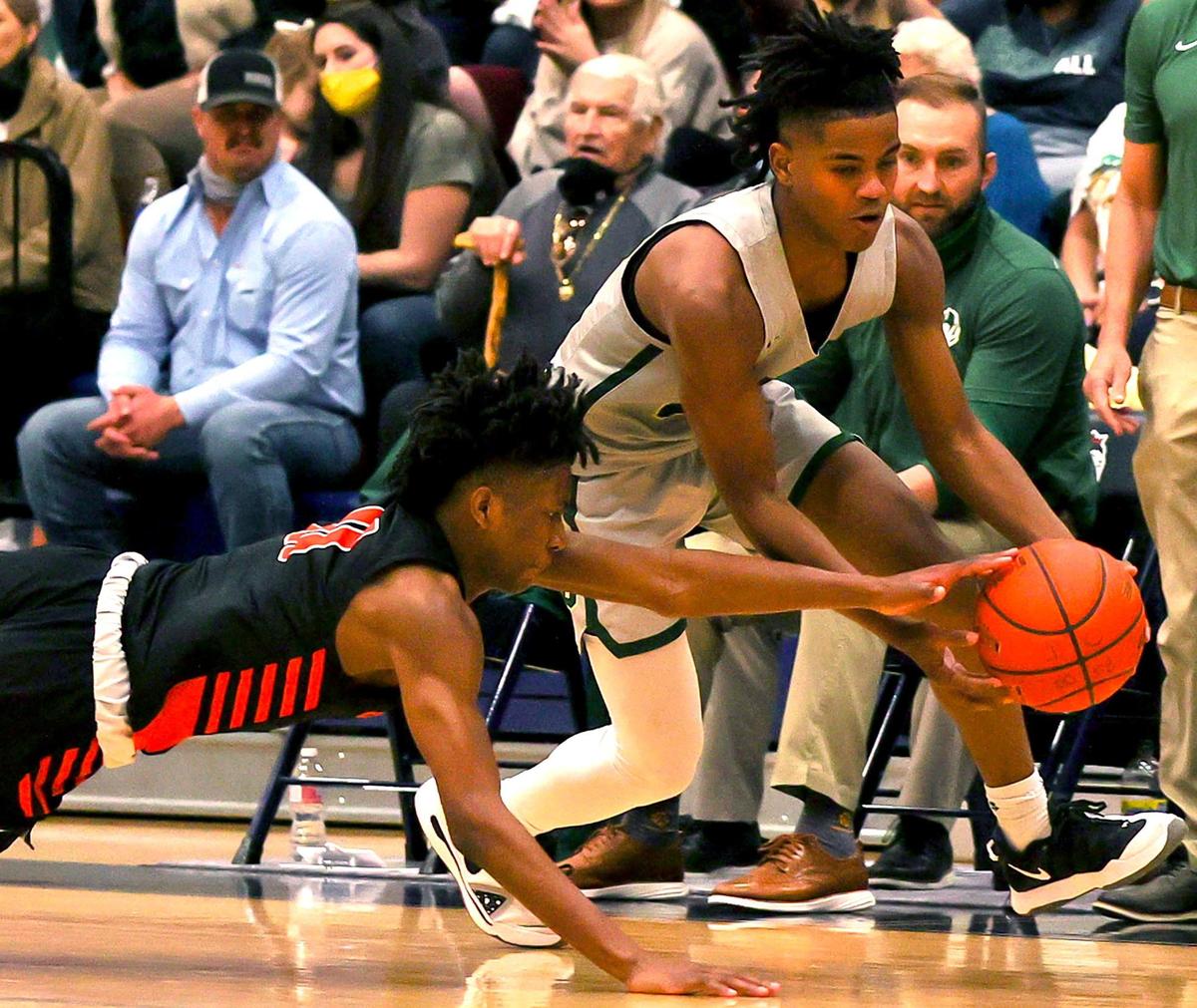 Aledo guard Exavier Anderson (L) goes for a steal against Birdville guard Daniel Sykes (R) during the second half of a 5A Bi-district Boys High School Basketball game played at Richland High School, February 20, 2021 in North Richland Hills, Tx. (Steve Nurenberg Special to the Star-Telegram)