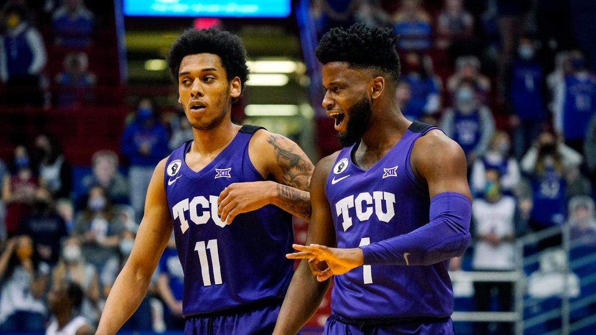 TCU Horned Frogs guard Mike Miles (1) reacts with guard Taryn Todd (11) after scoring against the Kansas Jayhawks during the first half at Allen Fieldhouse Thursday night.