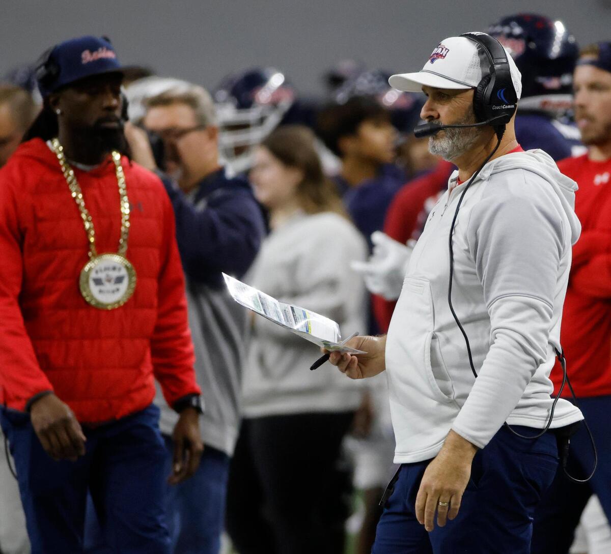 Denton Ryan head coach Dave Henigan watches second quarter action during the UIL 5A D1 Semifinals football game at The Ford Center in Frisco, Texas, Friday, Dec. 13, 2024.