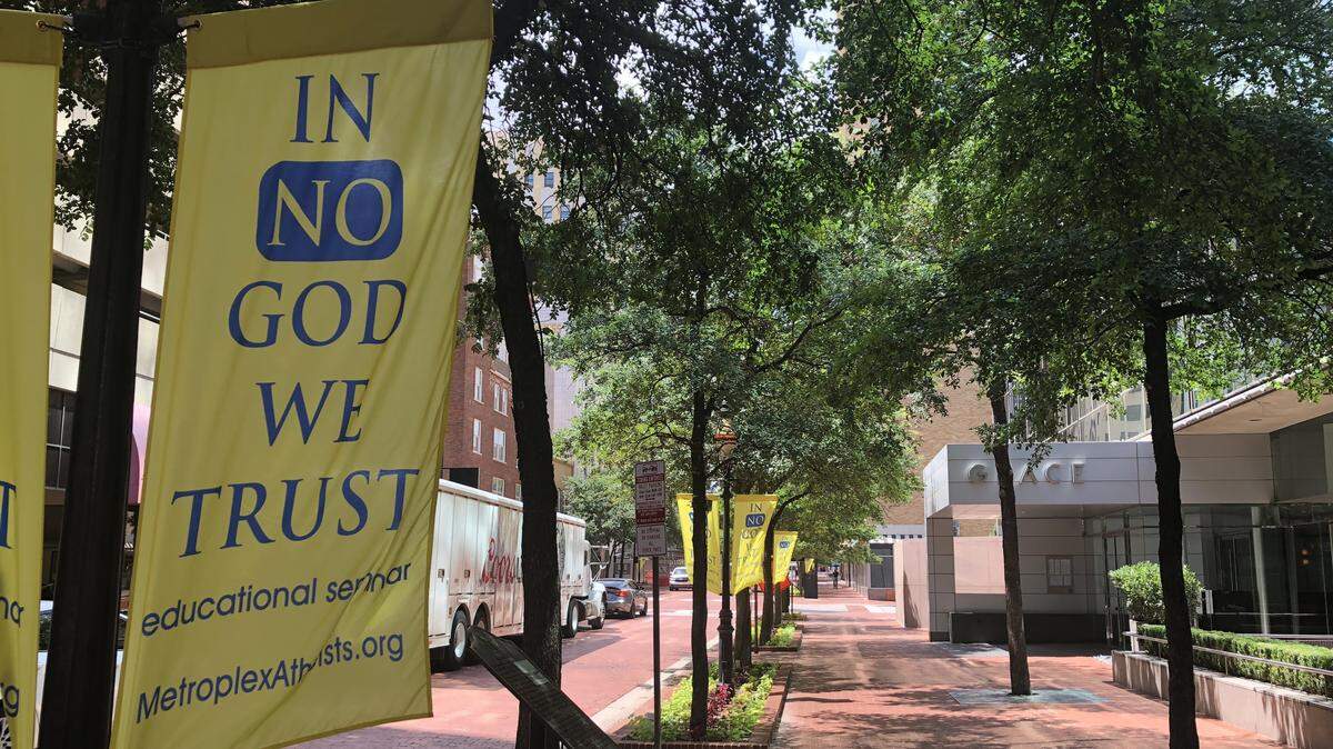 Banners hung up downtown saying “In No God We Trust” sparked backlash in Fort Worth on Tuesday. The banners promote an education seminar put on by a DFW atheist group.
