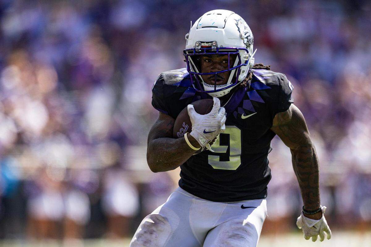 TCU running back Emani Bailey (9) rushes for a touchdown in the second half of a BIG 12 football game between the TCU Horned Frogs and the SMU Mustangs at Amon G. Carter Stadium in Fort Worth on Saturday, Sept. 23, 2023.