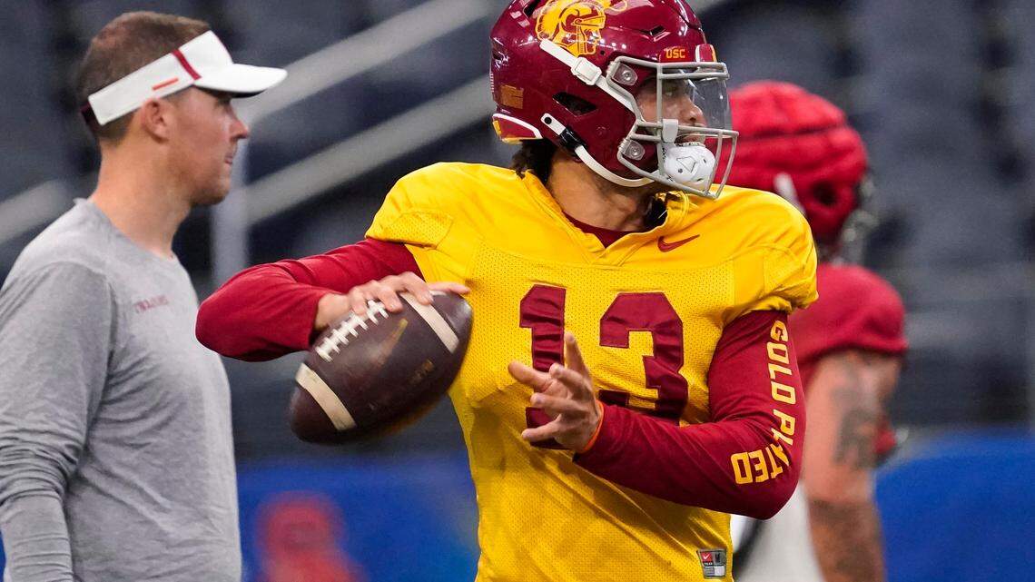 Southern California quarterback Caleb Williams (13) practices ahead of the Cotton Bowl NCAA college football game against Tulane.