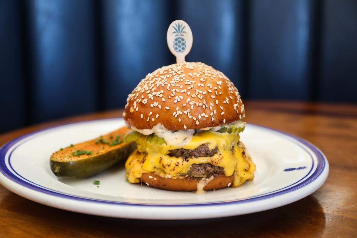 The Hudson House cheeseburger is a classic American double patty with pickles and special sauce. Burgers are only $10 on happy hour.