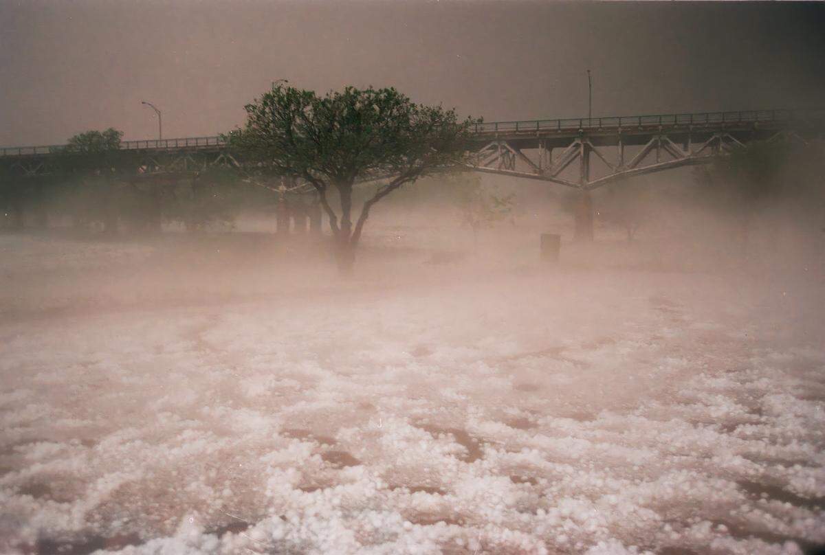 Steam rises from large hail, creating an eerie fog in Trinity Park at Mayfest May 5, 1995.