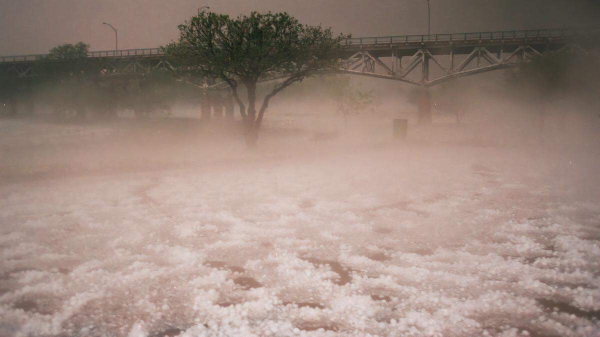 Steam rises from large hail, creating an eerie fog in Trinity Park at Mayfest May 5, 1995.