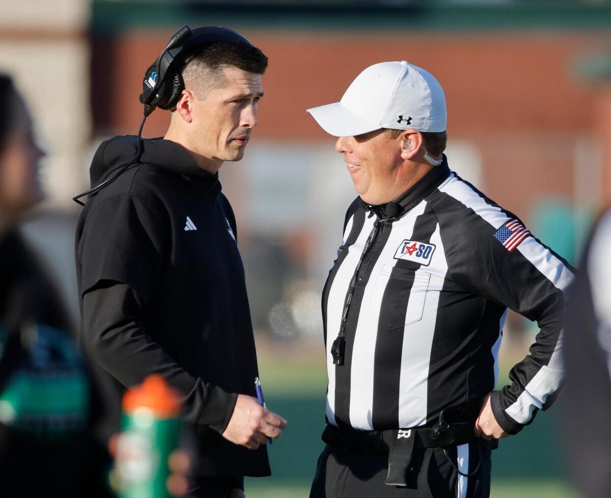 Southlake head coach Riley Dodge talks to the umpire during the UIL District 6A D2 Regional Semi-Finals football game at Joy and Ralph Ellis Stadium in Irving, Texas, Nov. 29, 2024.