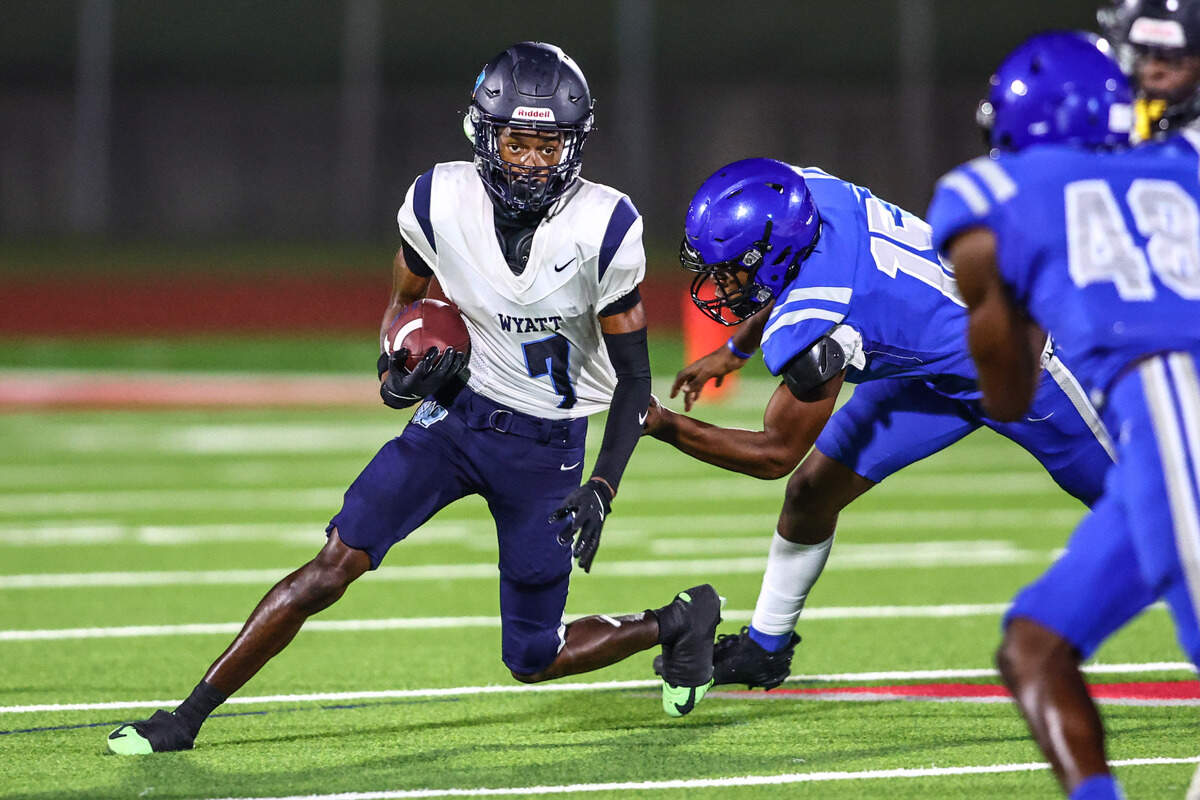 Wyatt receiver Neiman Griffin gets pulled down by Dunbar’s Travontay Huey-You on Thursday, September 5, 2024 at Clark Stadium in Fort Worth, Texas. Dunbar rallied to defeat Wyatt 14-13.