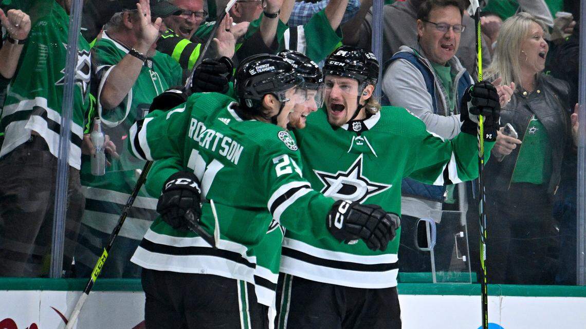 May 11, 2023; Dallas, Texas, USA; Dallas Stars left wing Jason Robertson (21) and defenseman Thomas Harley (55) and center Roope Hintz (24) celebrates a goal scored by Hintz against the Seattle Kraken during the first period in game five of the second round of the 2023 Stanley Cup Playoffs at American Airlines Center. Mandatory Credit: Jerome Miron-USA TODAY Sports