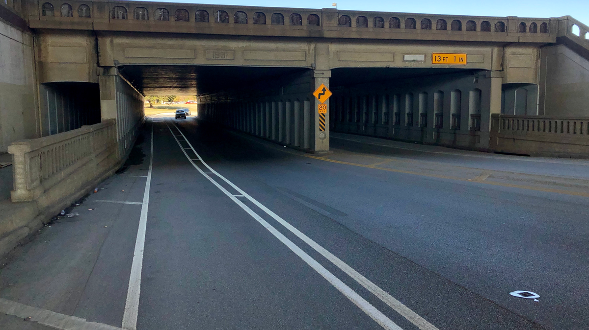 South Main underpass at Interstate 30. The roadway underneath is unlit.