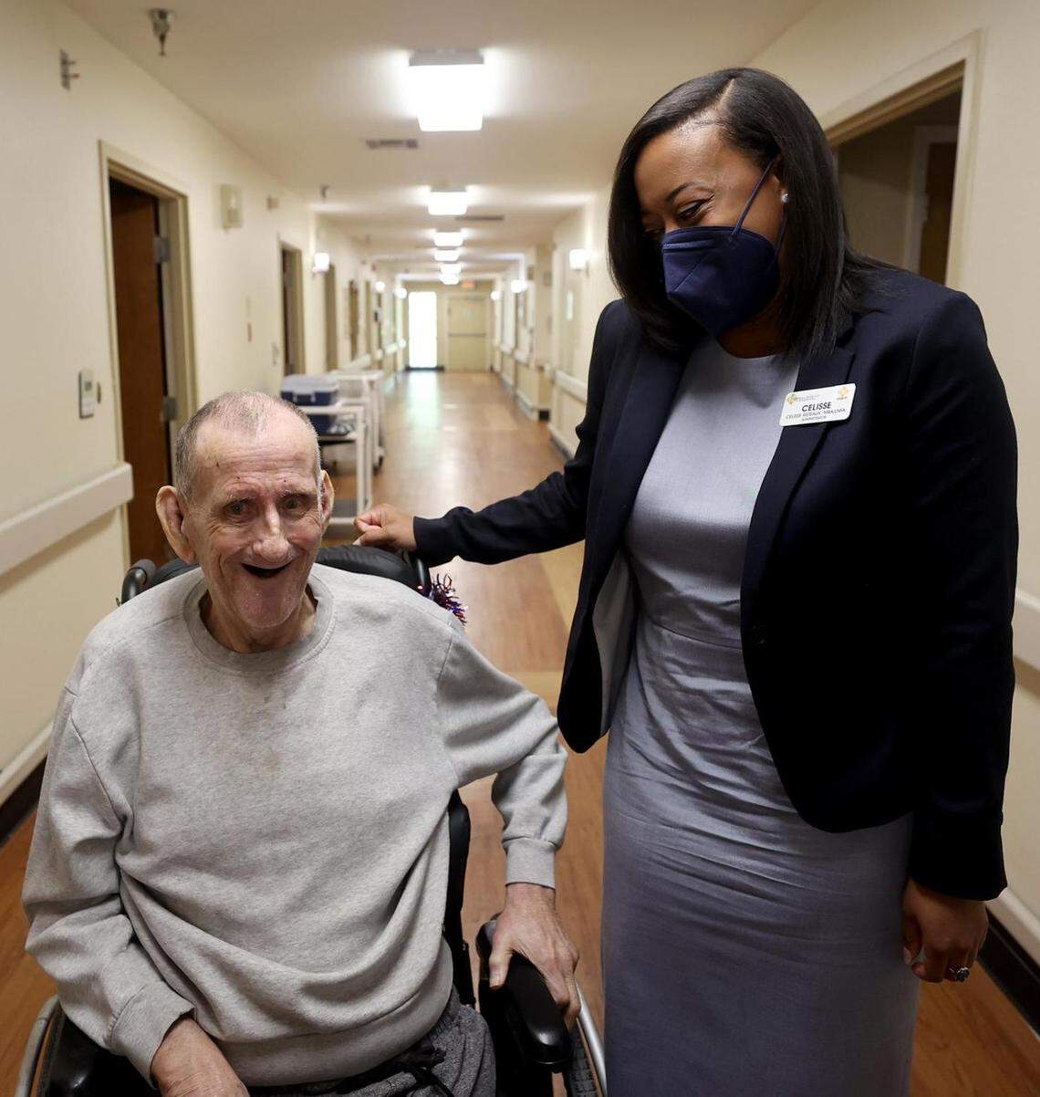 Celisse Rideaux, facility administrator at Heritage at Turner Park, talks with resident Noel Freeman.