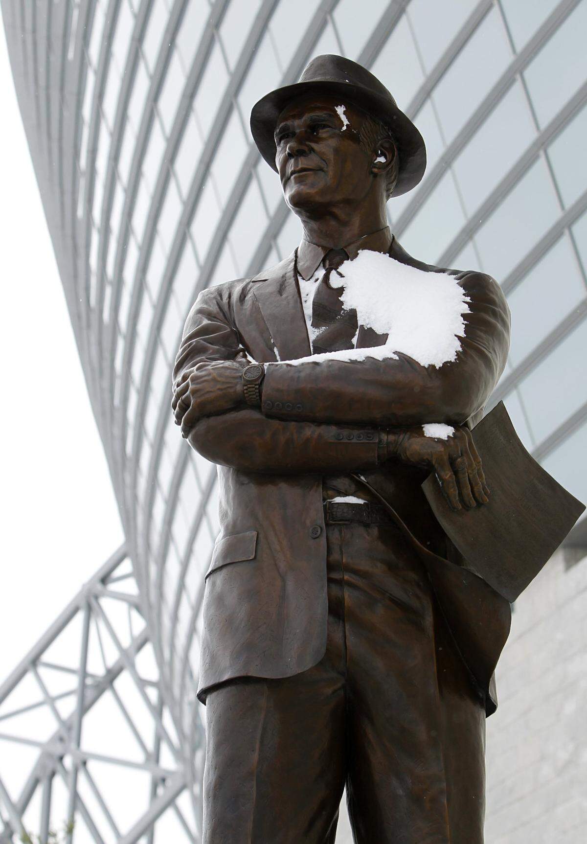 A bronze statue of the late Dallas Cowboys head coach Tom Landry was covered in snow outside of Cowboys Stadiumsite of Super Bowl XLV, after about 4 inches of snow fell since overnight, Friday, February 4, 2011.  (Tom Fox/The Dallas Morning News)