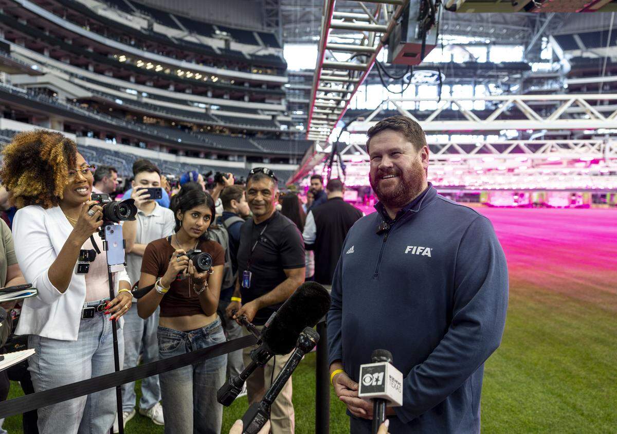 Ewen Hodge, head of pitch infrastructure for FIFA 2026, speaks to the media about preparations, including the installation of a natural grass pitch, being made for FIFA World Cup 2026 on Thursday, May 14, 2026 in Arlington, Texas. The stadium will host nine matches during the World Cup this summer.
