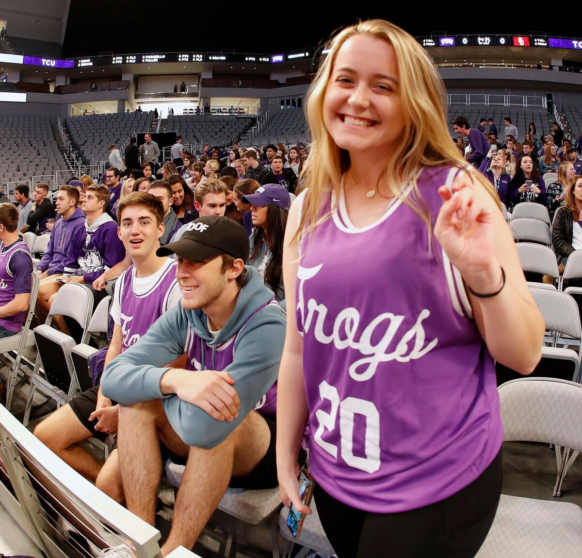TCU sophomore Margo Valadie gives the frog sign before an NCAA basketball game at Dickies Arena in Fort Worth, Texas, Friday, Dec. 6, 2019. TCU hosted USC in the inaugural basketball game at the new $540 million venue.