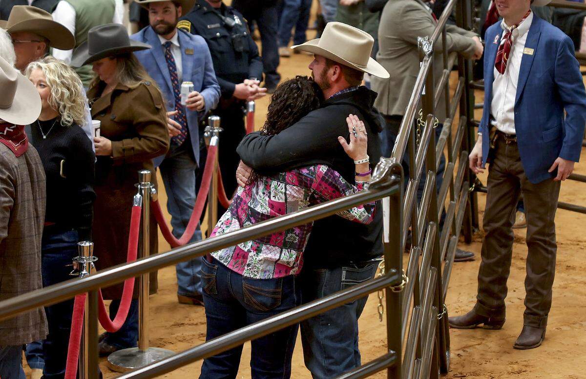 Casey and Bret Cody hug after their son, Caiman Cody received a record-breaking price for his junior grand champion steer at the Fort Worth Stock Show and Rodeo Junior Sale of Champions on Saturday, Feb. 7, 2026. White Castle was bought by Trico Electric for $550,000.