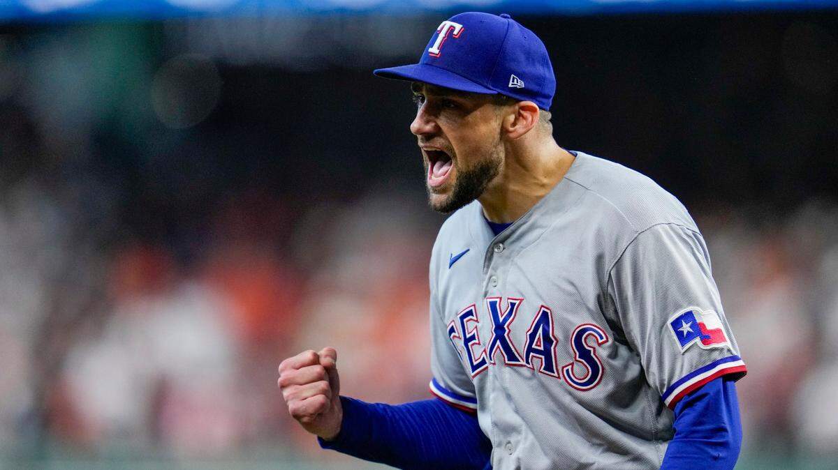 Texas Rangers starting pitcher Nathan Eovaldi reacts after getting out of a bases-loaded jam during the fifth inning of Game 2 of the baseball AL Championship Series against the Houston Astros, Monday, Oct. 16, 2023, in Houston.