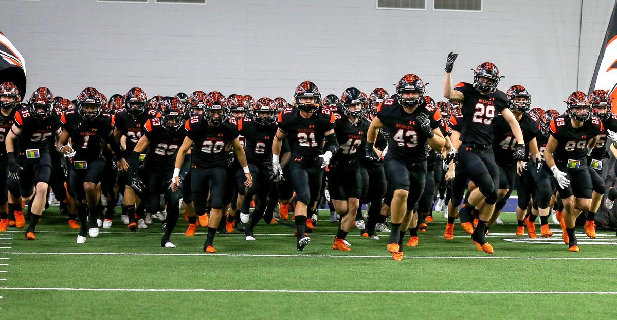 The Aledo Bearcats enter the field to face the Ennis Lions in the 5A Division II State quarterfinal high school football playoff game played at the Ford Center in Frisco, TX Friday, December 6, 2019.