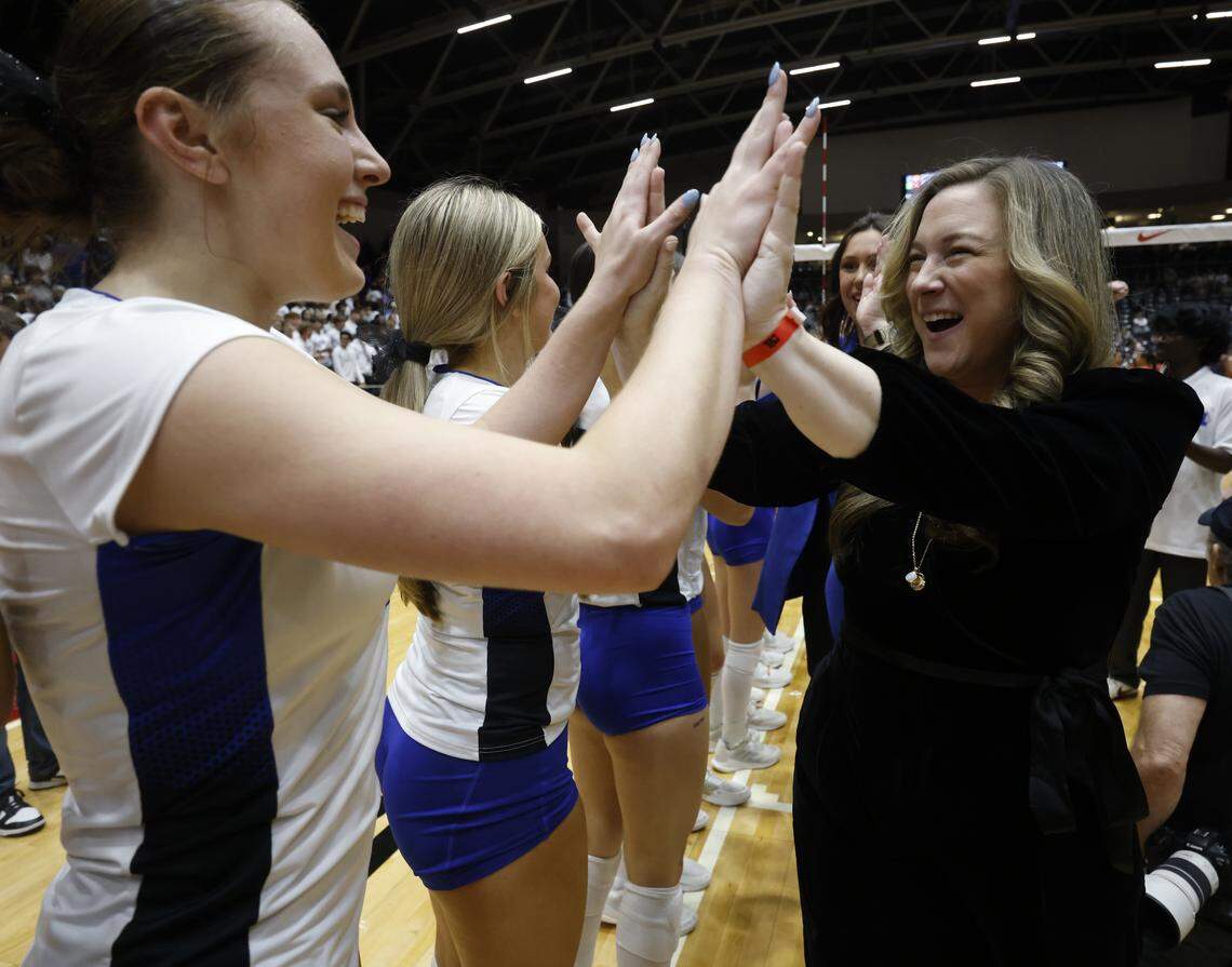 Trophy Club Byron Nelson head coach Brianne Groth high fives with all of the team after defeating Pearland Dawson in the UIL Class 6A Division I state volleyball championship game Saturday Nov. 22, 2025 at Curtis Culwell Center in Garland, Texas.