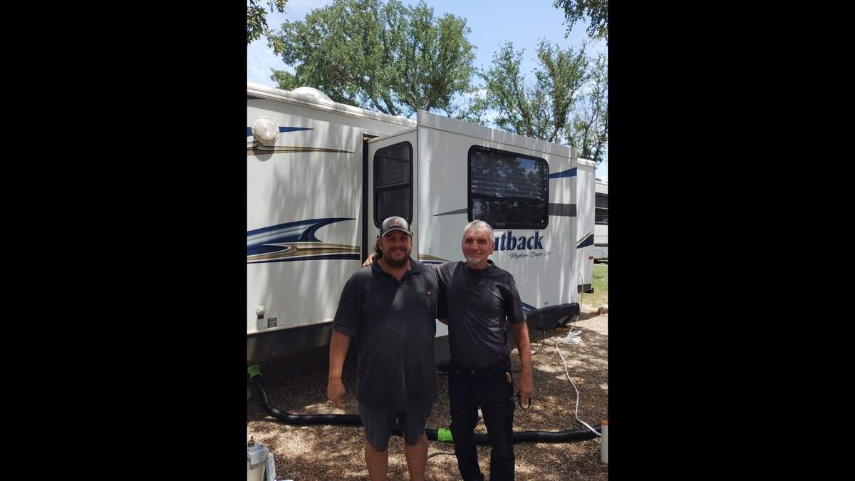 Bobby Crutsinger (left) of Operation Texas Strong and Tom stand outside the RV that Tom can now call home after 20 months of living on the streets. The 65-year-old veteran received the title on Friday, May 22.