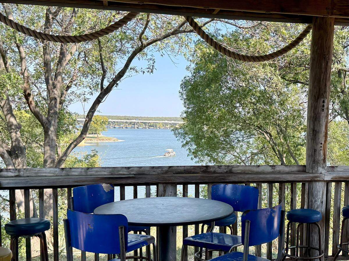 A shaded patio offers a view at The Point on Lake Worth restaurant in Fort Worth, Oct. 12, 2024.