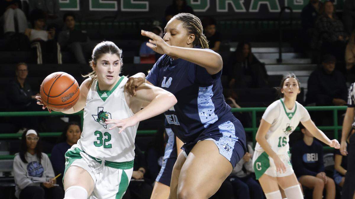 Southlake forward Jillian Hall (32) turns the corner on L.D. Bell point Madi Capers (23) during the second half of a UIL girls basketball game between L.D. Bell and Southlake Carroll at Southlake Senior High School in Southlake, Texas, Tuesday Feb. 03, 2026