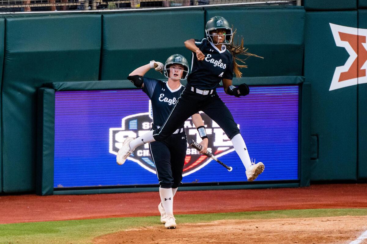 Kassidy Chance (4) and Maggie Miller celebrate during the 6A UIL State Softball Final between Lake Ridge and Northside O’Conner in Austin Texas, on June 4th, 2022.