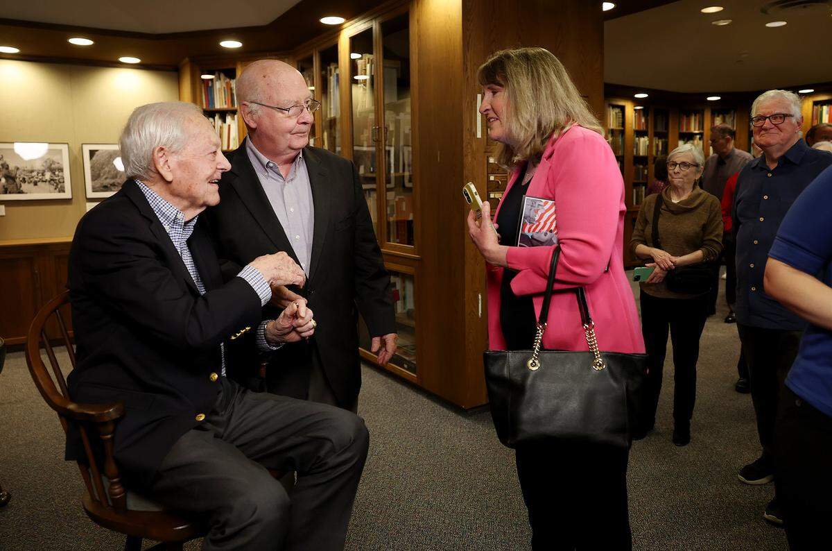 Bob Schieffer talks with attendees of the public opening of the special collection of his photographs taken for the Fort Worth Star-Telegram during the Vietnam War, called “Our Man In Vietnam,” on Monday, Feb. 9, 2026, at UT Arlington.