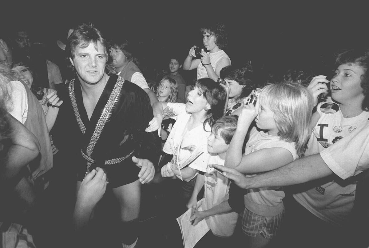 1984: Wrestler Chris Adams makes his way through crowd during a Labor Day wrestling event at the Tarrant County Convention Center.