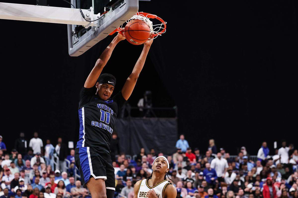 North Crowley forward Trey Hall dunks during the Class 6A Division I state championship game against San Antonio Brennan on Saturday at the Alamodome in San Antonio.