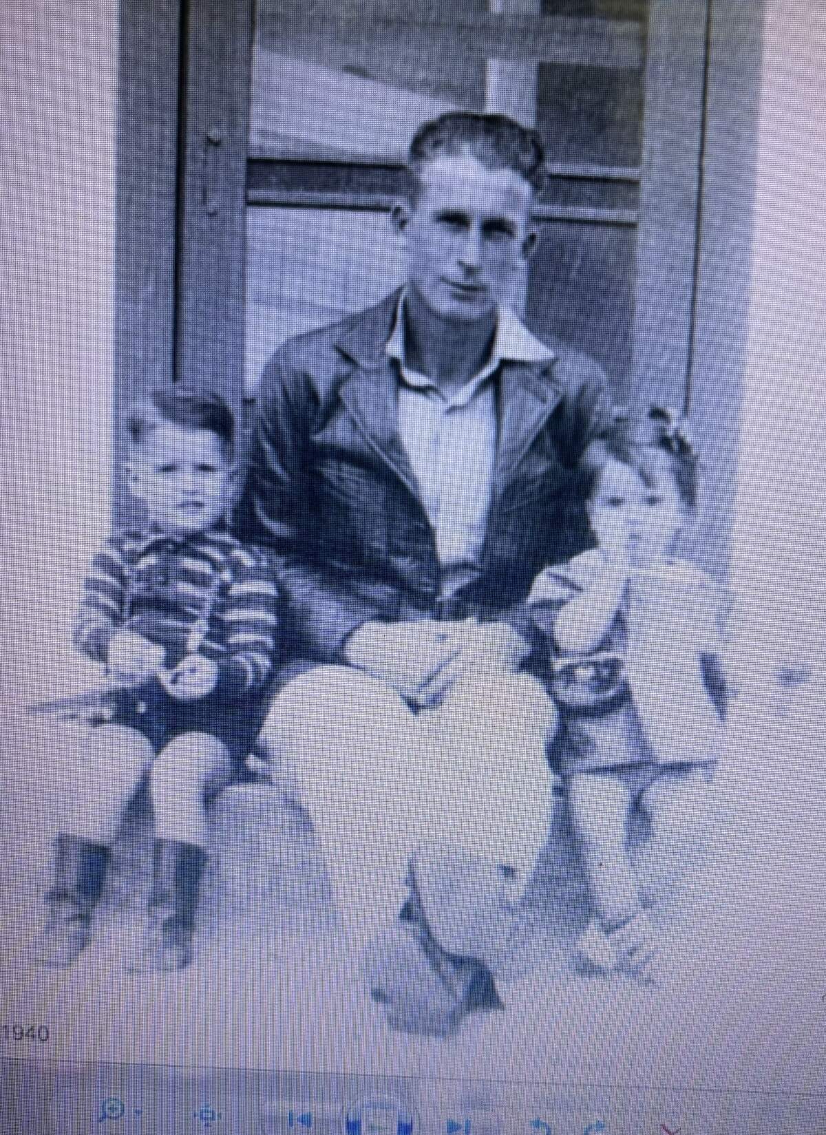 Max McMillon, left, at age 4 at his family’s home in Greenville, Texas, holding a toy tin airplane, which was the catalyst for what became an extensive career as a military and commercial airline pilot. He is shown with his father and sister in this photo.