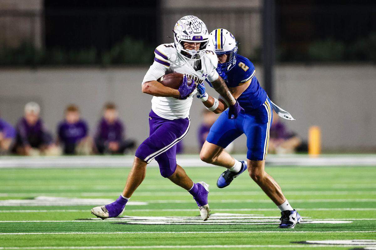 Alvarado wide receiver Schyler DeThorne runs past a Sulphur Springs defensive back in a Class 4A Division I area playoff game Friday, Nov. 21, 2025, at Children’s Health Stadium in Prosper, Texas.