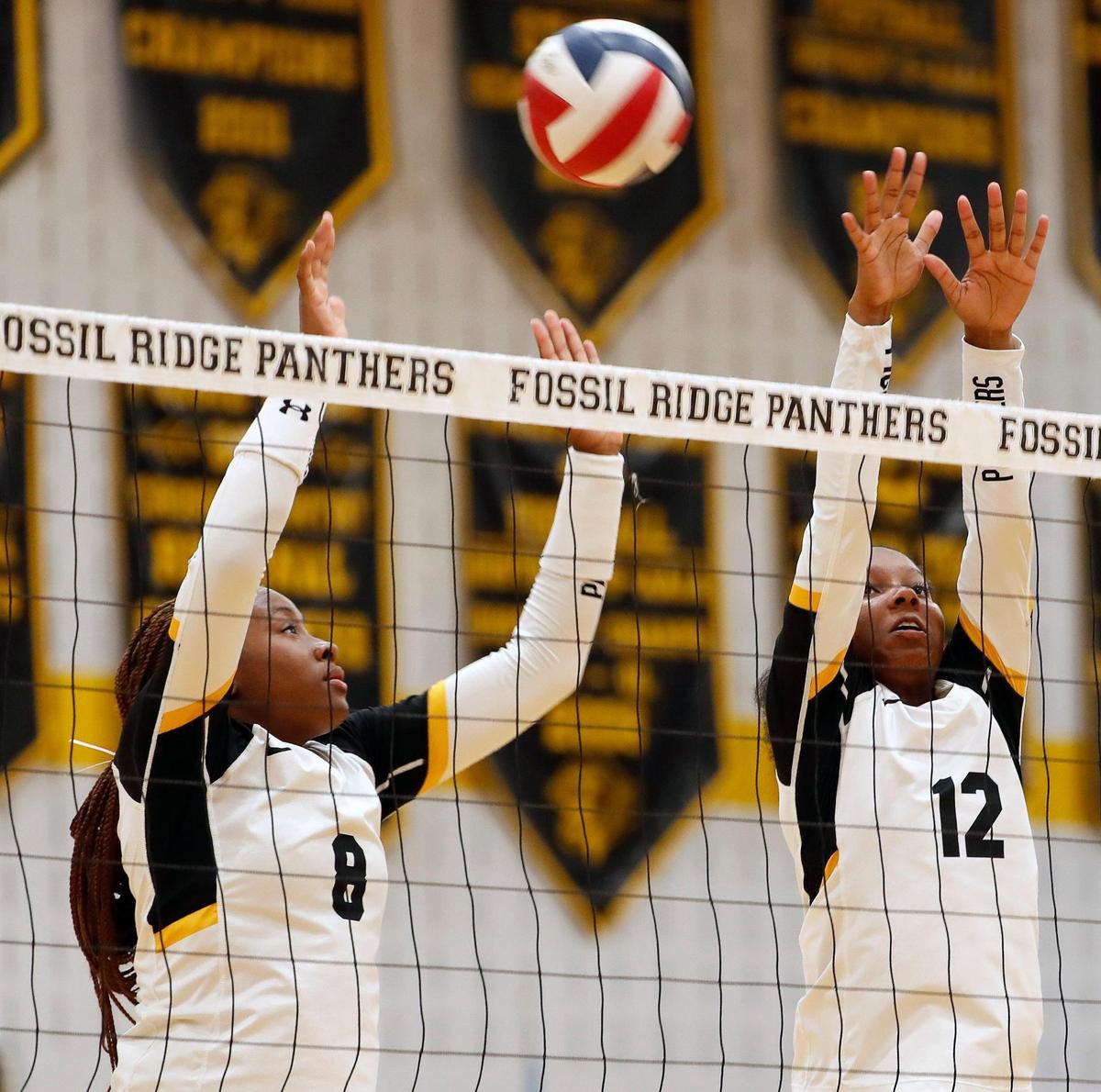 The ball is just out of the reach of Fossil Ridge outside hitter Jordyn Carpenter (8) and NyKaela Mays (12) during the second game in a three-out-of-five District 4-6A high school volleyball game at Fossil Ridge High School in Fort Worth Texas, Tuesday, Oct. 04, 2022. Fossil Ridge defeated Keller Central in three straight games, 25-21, 25-20 and 25-21. (Special to the Star-Telegram Bob Booth)
