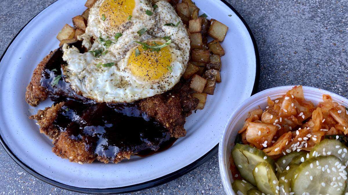 Birdie Bop brunch: katsu fried chicken-and-eggs, housemade pickles and kimchi.