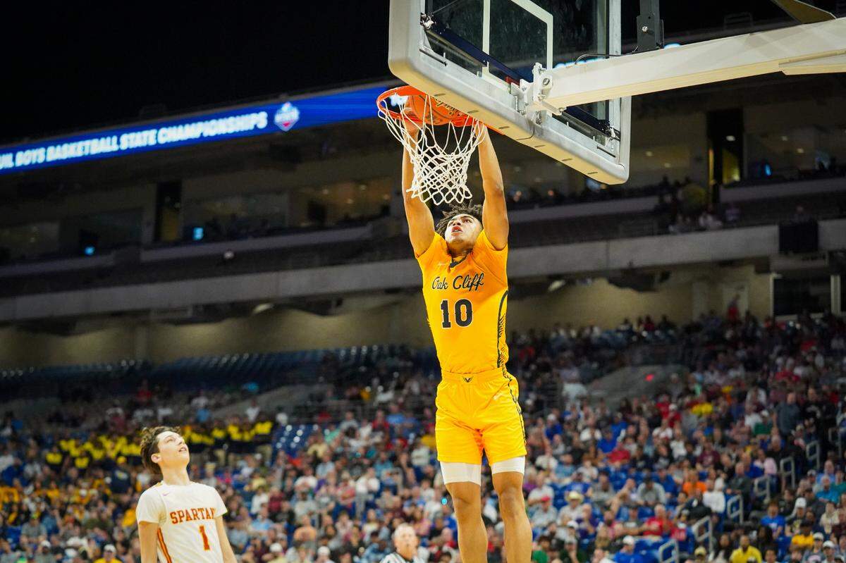 Dallas Oak Cliff Faith Family guard Isaac Williams dunks for two of his game-high 19 points against Stafford in a Class 4A state semifinal on Friday, March 8, 2024 at the Alamodome in San Antonio, Texas. Faith Family defeated Stafford 59-40.