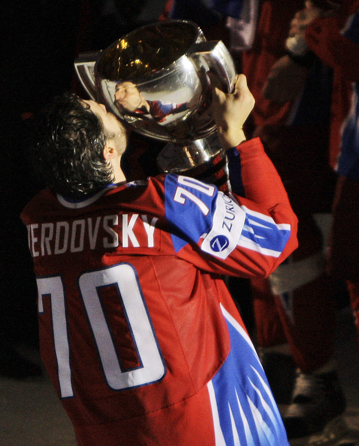 Russia’s Oleg Tverdovsky celebrates with the trophy after Russia beat Canada 2-1 in the final of the World Ice Hockey Championship match in Bern, Switzerland, Sunday, May 10, 2009. (AP Photo/Anja Niedringhaus)