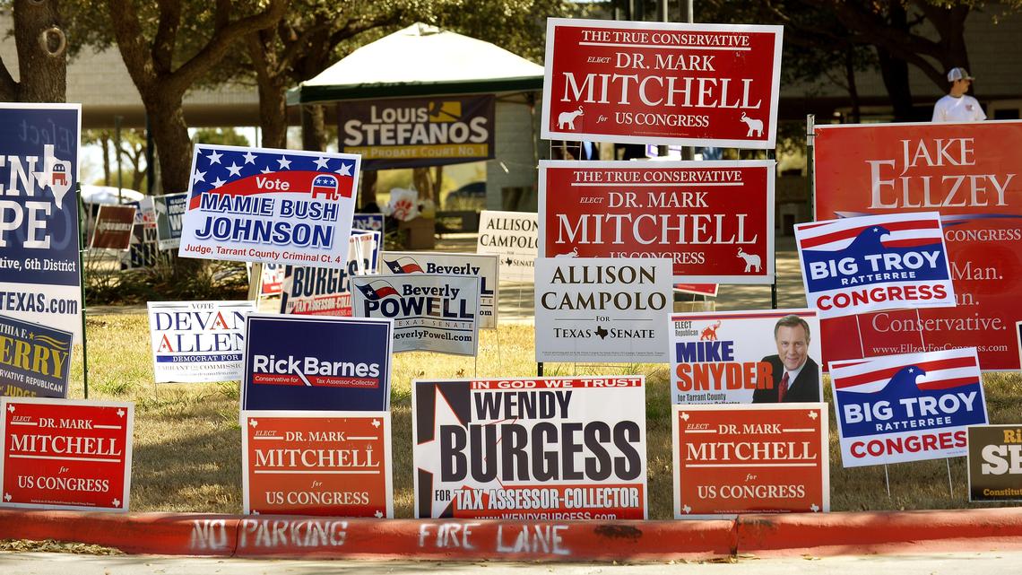 Campaign signs on display as voters head to the polls for the 2018 midterm primaries at Tarrant County Sub-Courthouse in Mansfield.