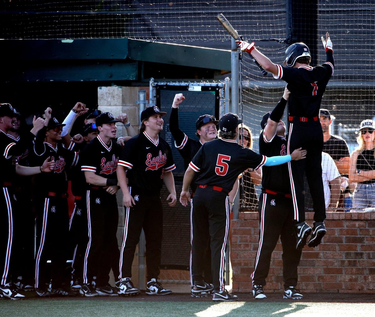 Argyle infielder Grady Emerson is lifted in the air after scoring the first run of game 2 of a UIL Conference 5A Regional final baseball game at Nathan F. Sanford Field at L.D. Bell in Hurst, Texas, Friday May 31, 2024.