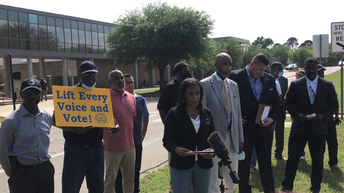 Arlington NAACP President Alisa Simmons and members of the NAACP and Lamar Alumni Alliance address media in front of Lamar High School about concerns with Lamar High School’s hiring process for a new head football coach.