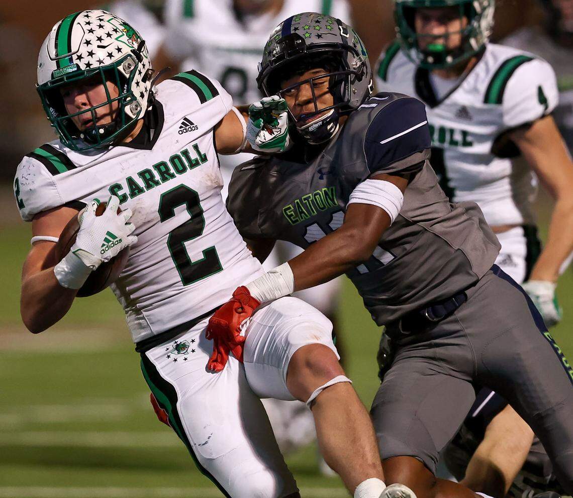 Southlake Carroll running back Owen Allen (2) gets brought down by Eaton cornerback Chase Whitebear (11) after a nice run during the first half in a District 4-6A high school football game played at Northwest ISD Stadium on Thursday, October 21, 2021, in Justin. (Steve Nurenberg/Special to the Star-Telegram)