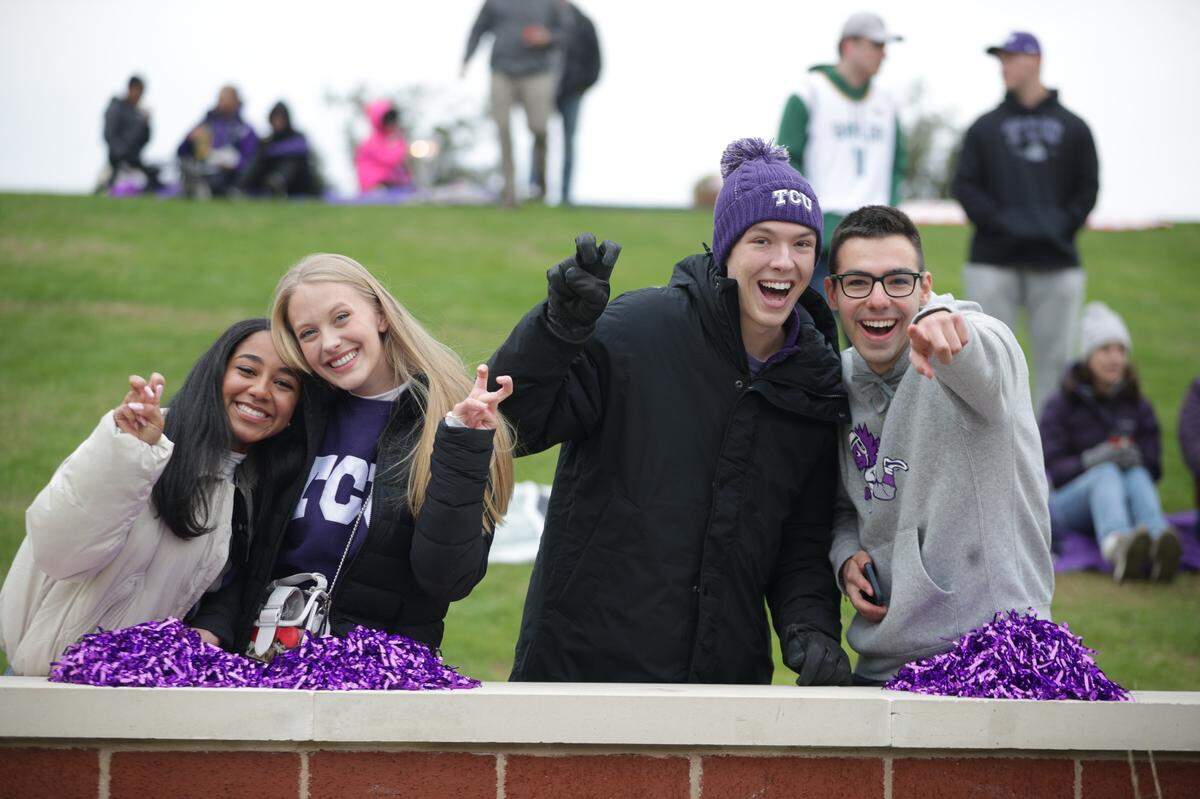 TCU fans celebrate at the edge of the field before their game against Baylor at McLane Stadium in Waco on Saturday, Nov. 19, 2022.